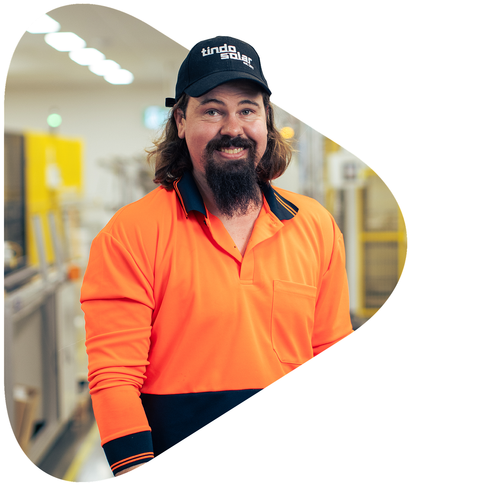 Solar power apprentice in trade uniform onsite at energy sector workplace