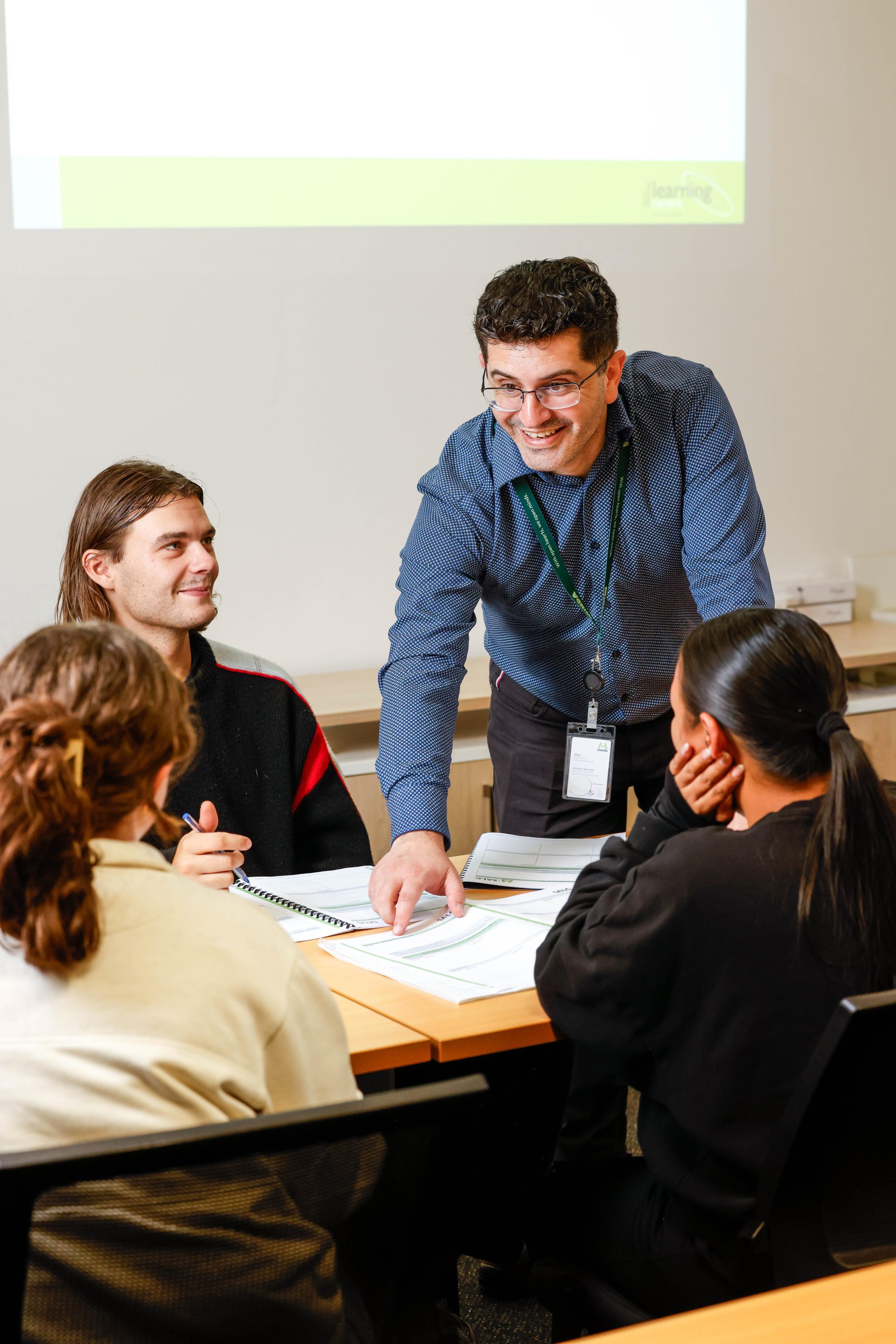 Lecturer in class with students